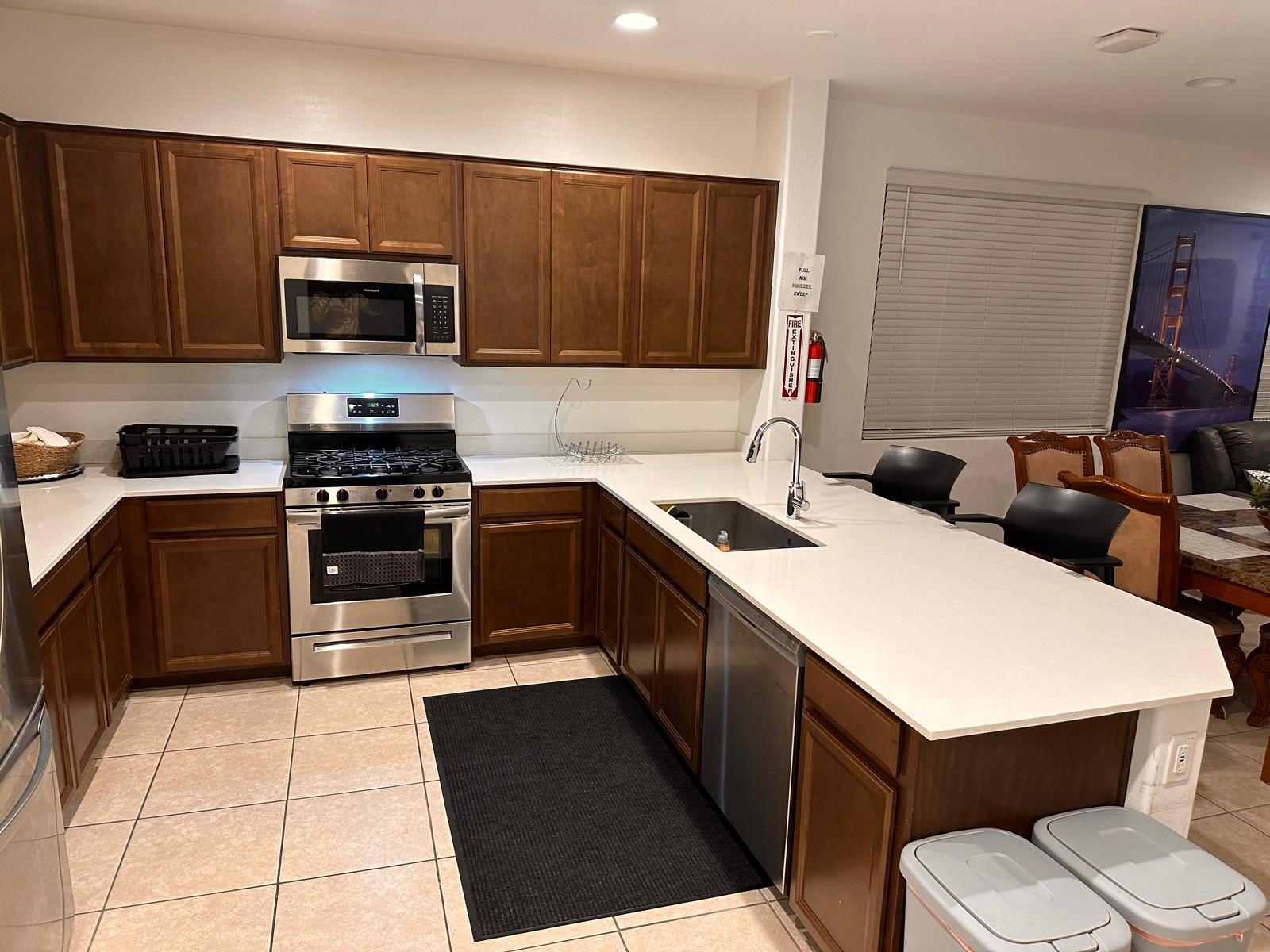 A well-equipped, home-style kitchen at a DiVnity residence