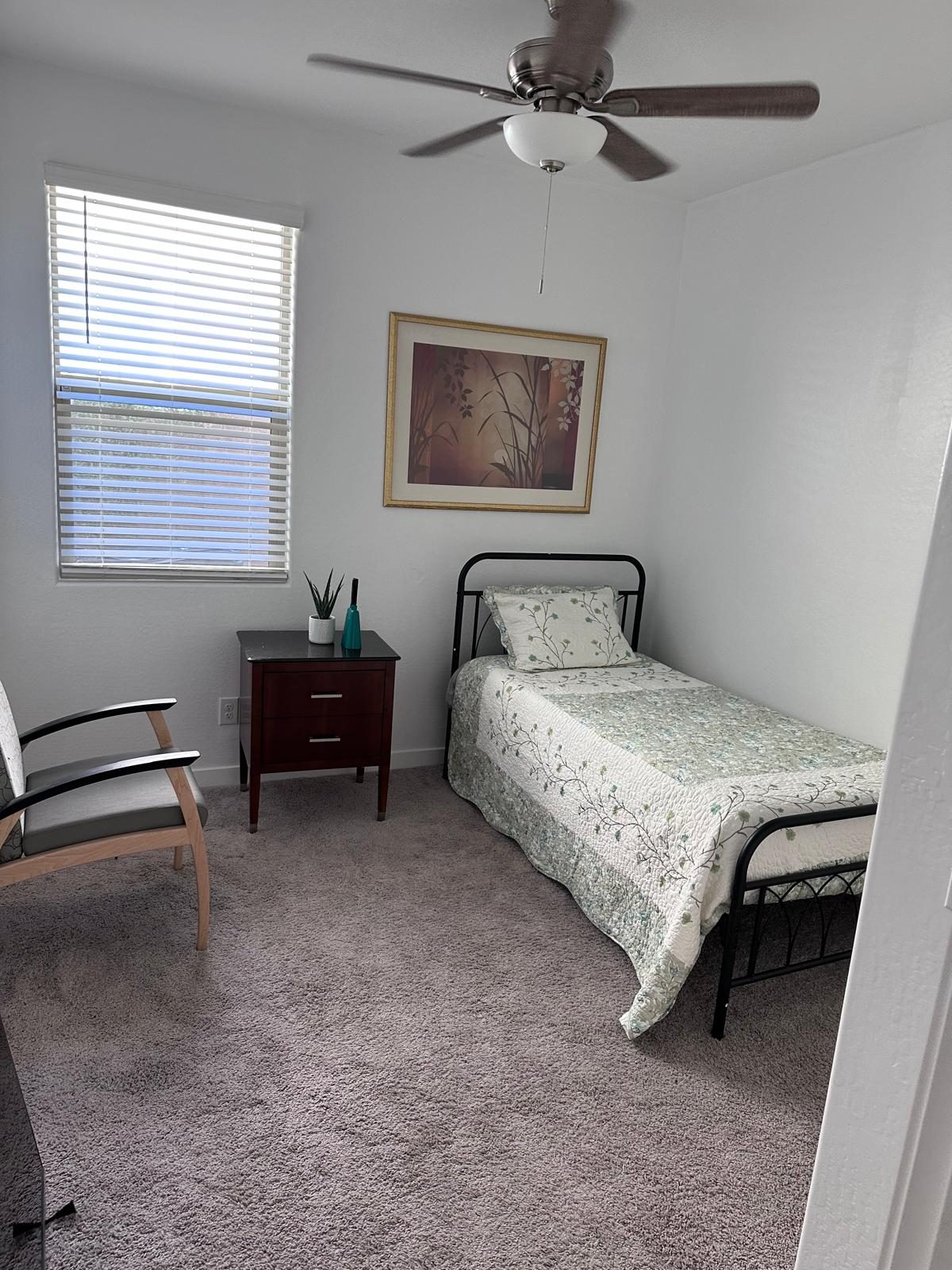 A calm, tidy bedroom in a DiVnity residence with natural light